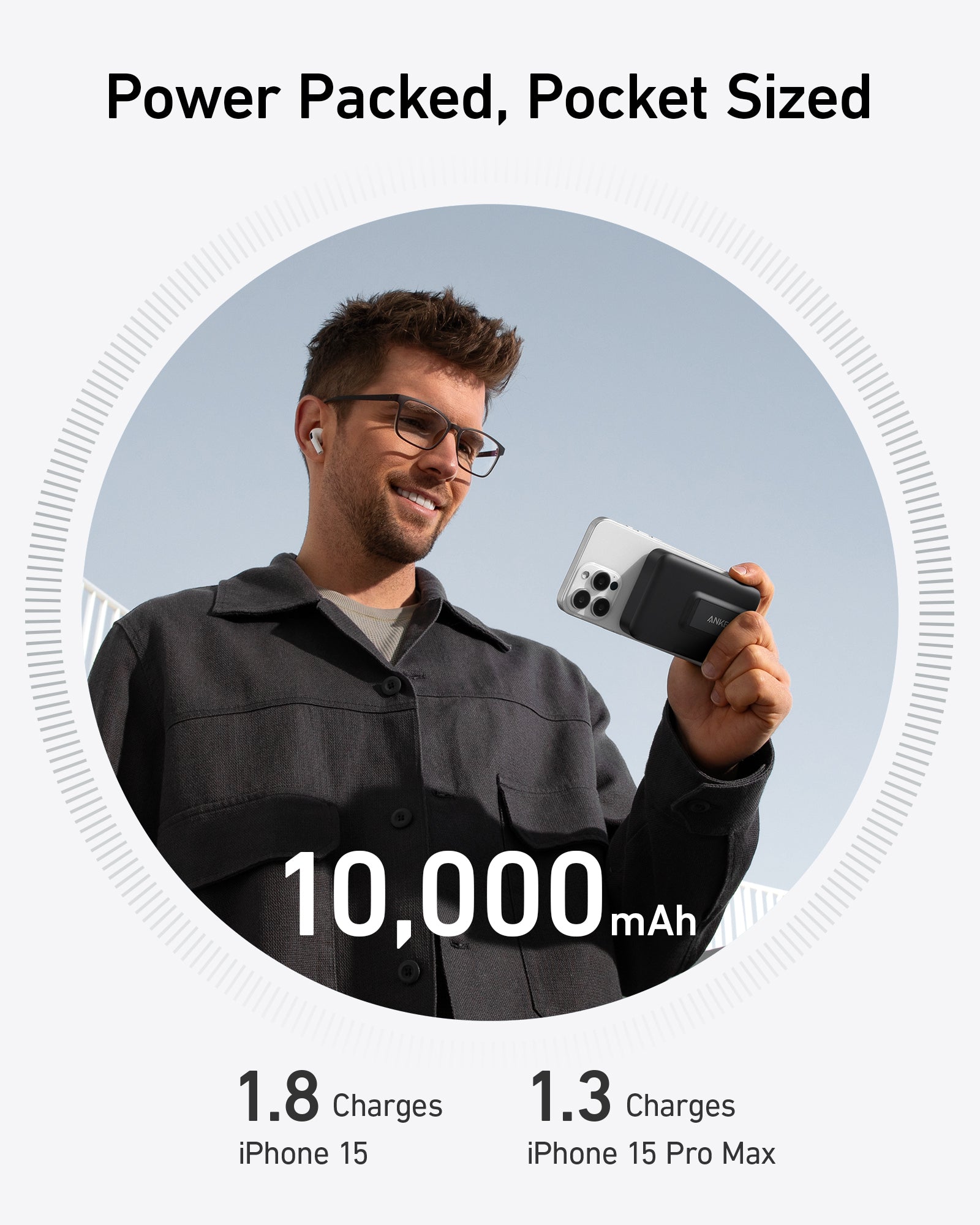 Man holding Anker 10,000mAh power bank for charging iPhone 15